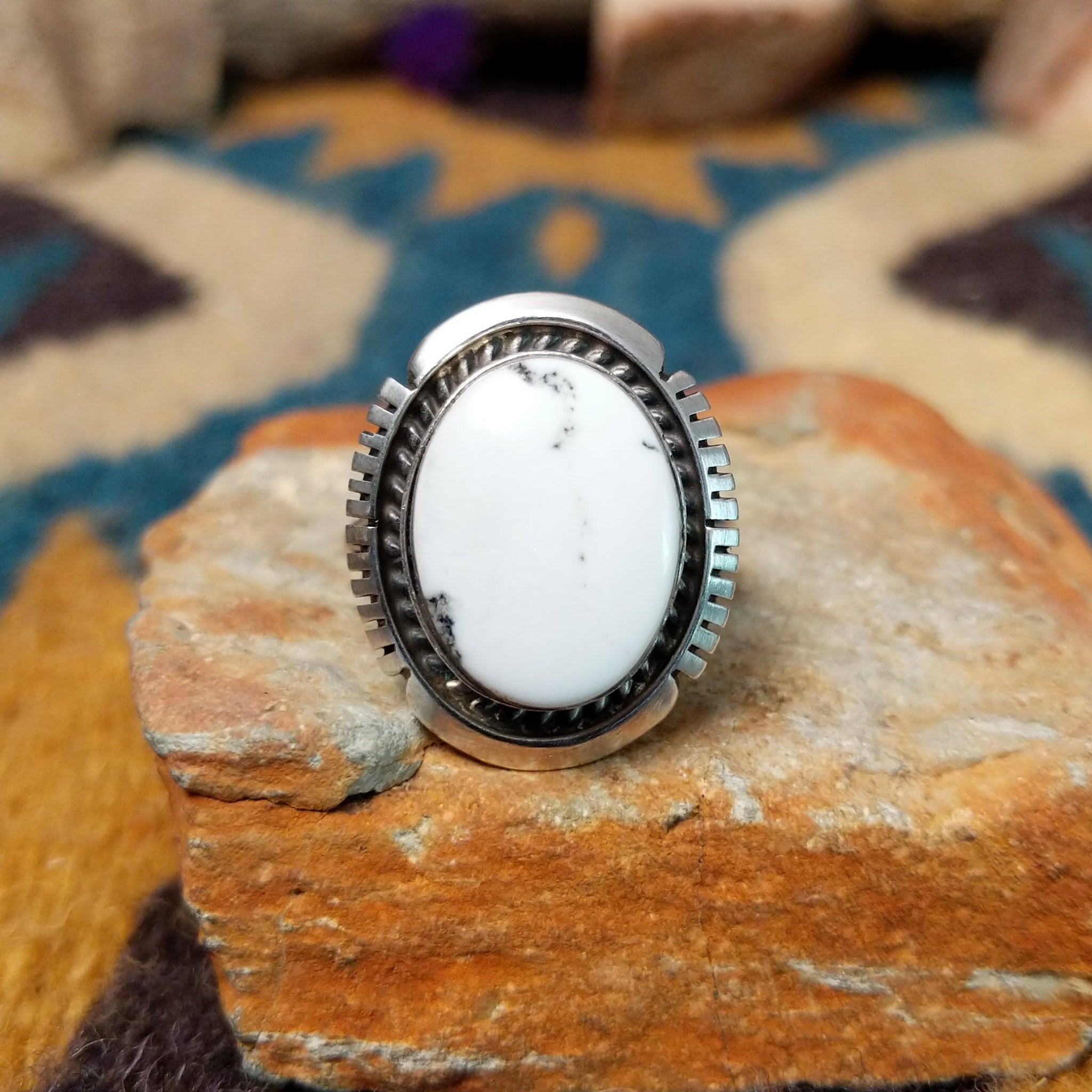 White Buffalo sterling silver ring by Alfred Martinez with an oval white stone and natural black veining.