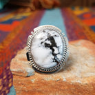White Buffalo Round Ring by Larson Lee featuring a large White Buffalo stone with black matrix set in Sterling Silver with twisted rope and geometric silver detailing.