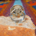 White Buffalo Round Ring by Larson Lee featuring a large White Buffalo stone with black matrix set in Sterling Silver with twisted rope and geometric silver detailing; underside view.