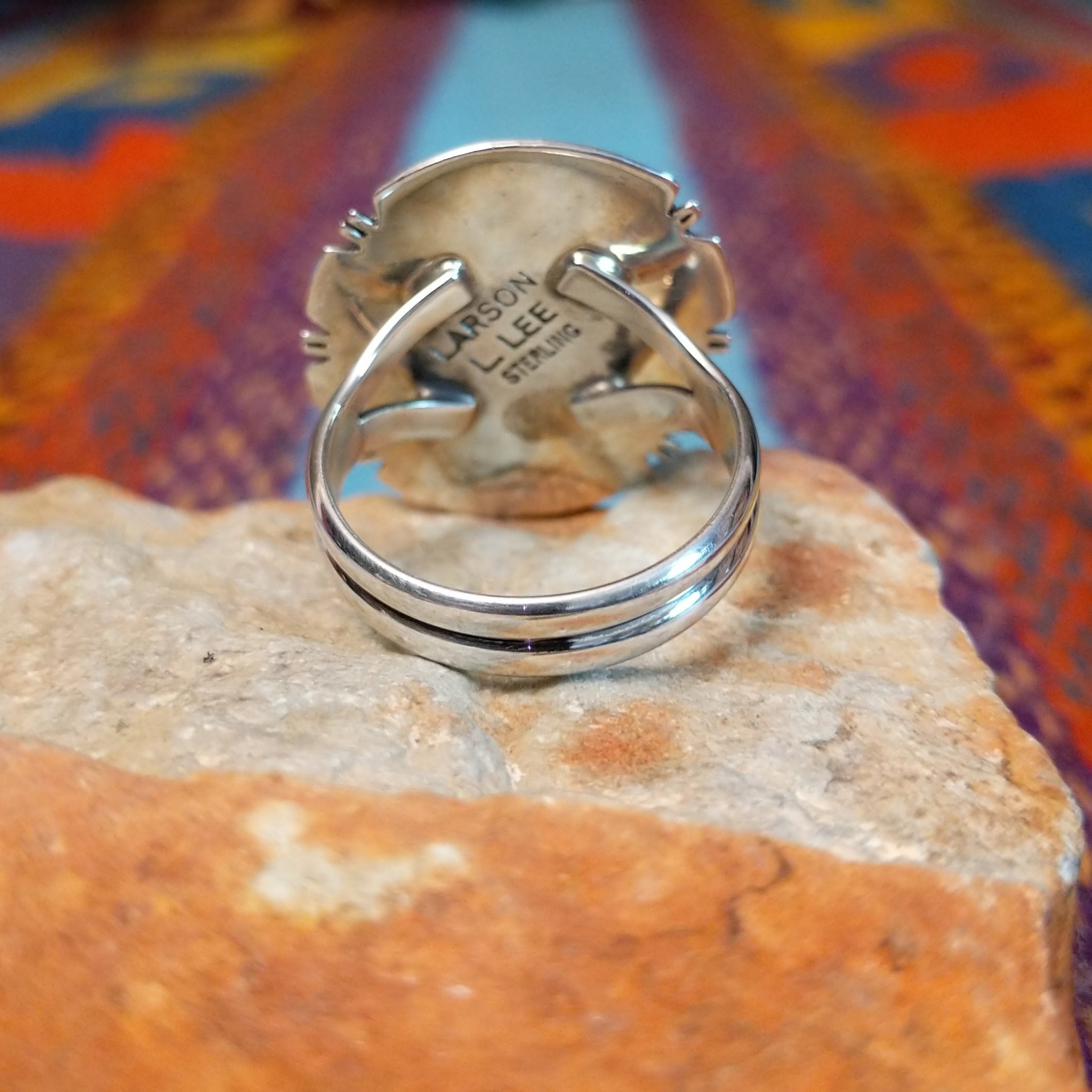 White Buffalo Round Ring by Larson Lee featuring a large White Buffalo stone with black matrix set in Sterling Silver with twisted rope and geometric silver detailing; underside view.