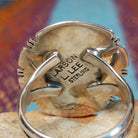 White Buffalo Round Ring by Larson Lee featuring a large White Buffalo stone with black matrix set in Sterling Silver with twisted rope and geometric silver detailing; artisan and Sterling Silver stamp.