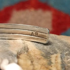Close-up of the artisan's stamped signature.