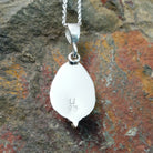 Handcrafted sterling silver White Water turquoise pendant by Lucy Jake, featuring a natural blue-green stone in a traditional Navajo setting; artisan and Sterling Silver stamp.