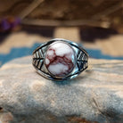 Sterling silver ring features wild horse stones set in round bezel and stamping on the band.