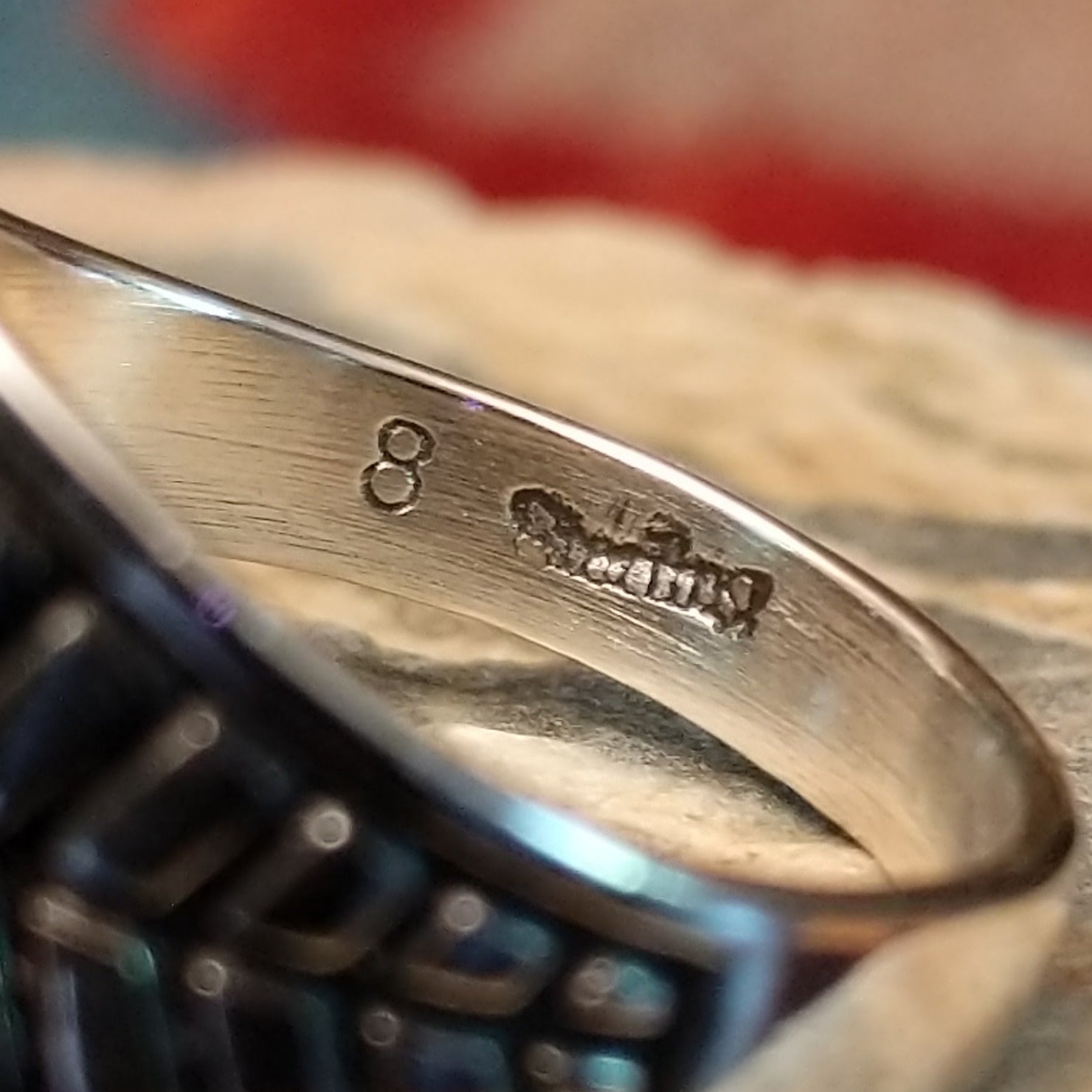 Close-up of the artisan's stamped signature.