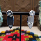 Wild Horse Earrings by Diane Wylie featuring elongated navette-shaped stones with white and reddish-brown matrix patterns set in smooth silver bezels; artisan and Sterling Silver stamp.
