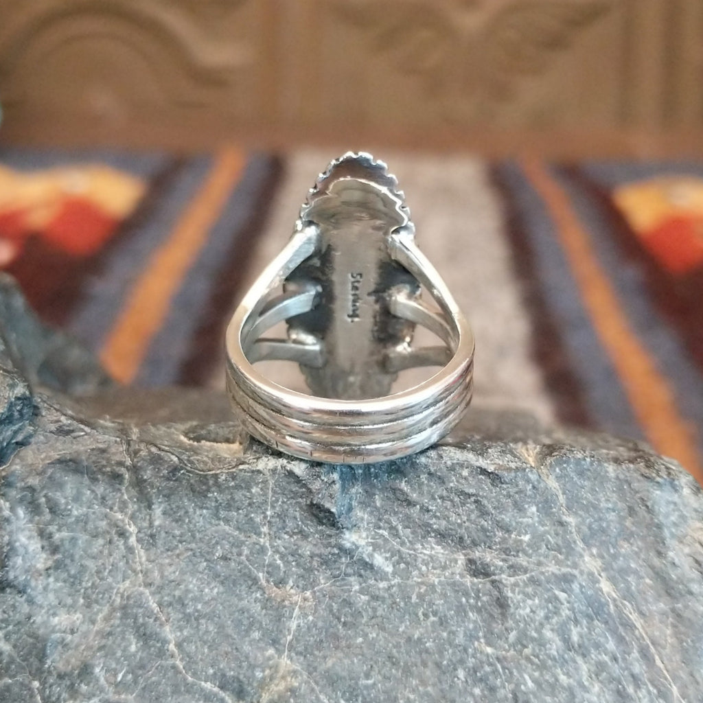 The polished three layered band of the ring.