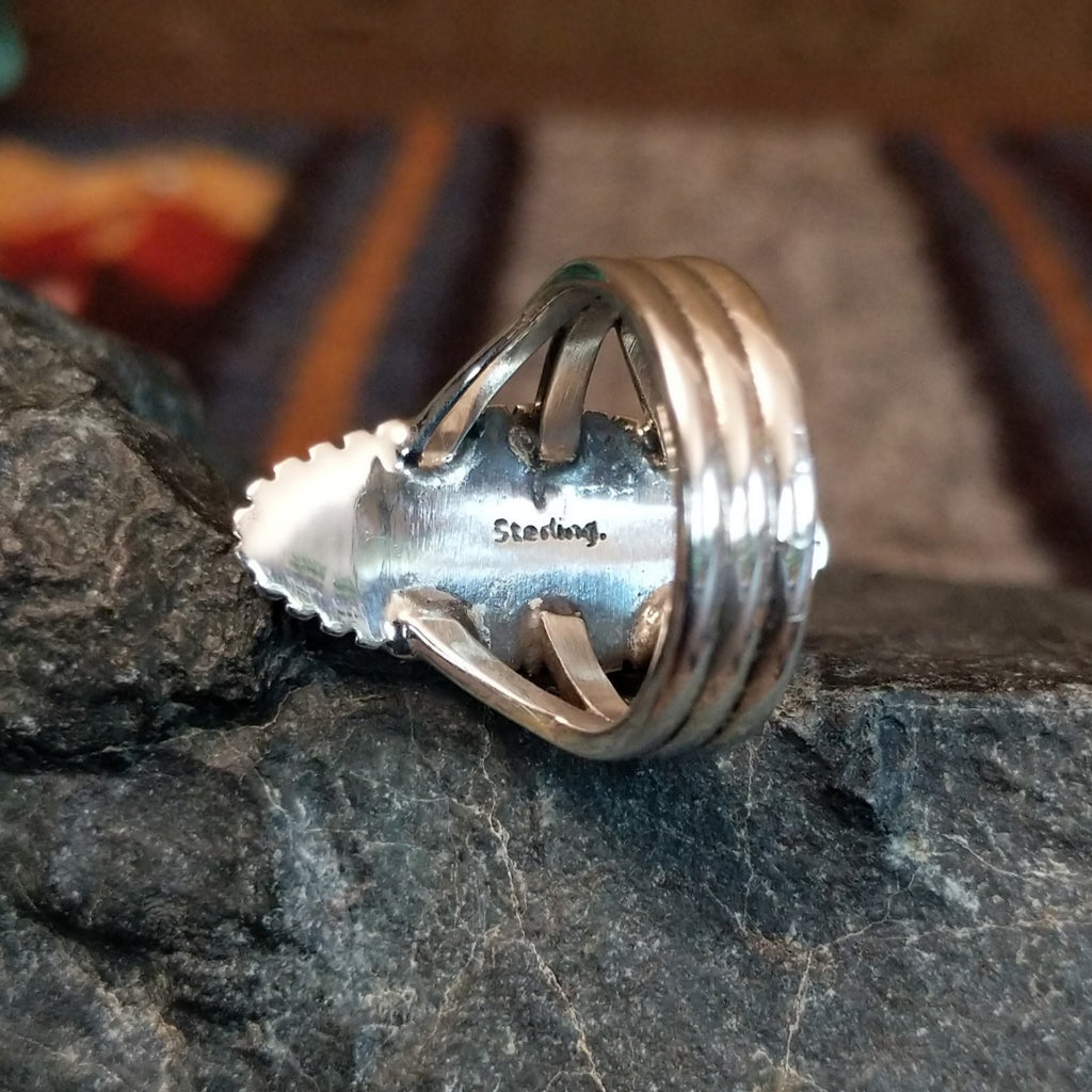 The sterling silver authentication stamp found on the underside of the bezel.