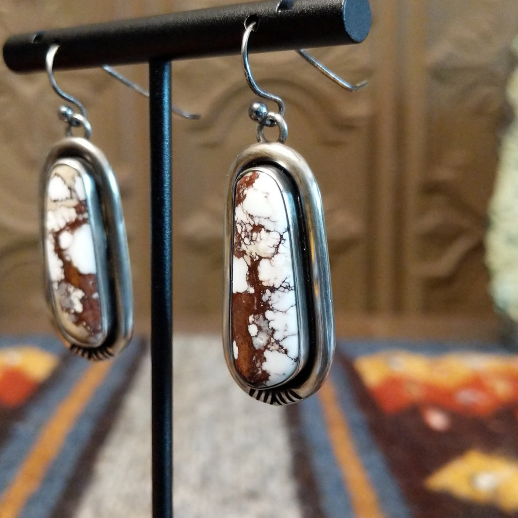 Wild horse stones set in sterling silver bezels that dangle.