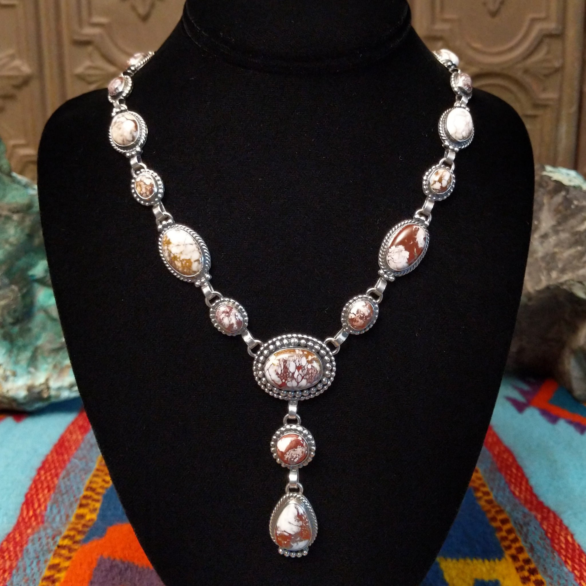 Wild Horse Sterling Silver necklace by Mary Ellen, featuring natural white, cream, brown, and reddish matrix stones in an intricate handcrafted design.