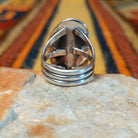 Rear view of a sterling silver Wild Horse stone ring by Terry Wood showing the open triple split-shank band, smooth setting back, and sterling silver hallmark.