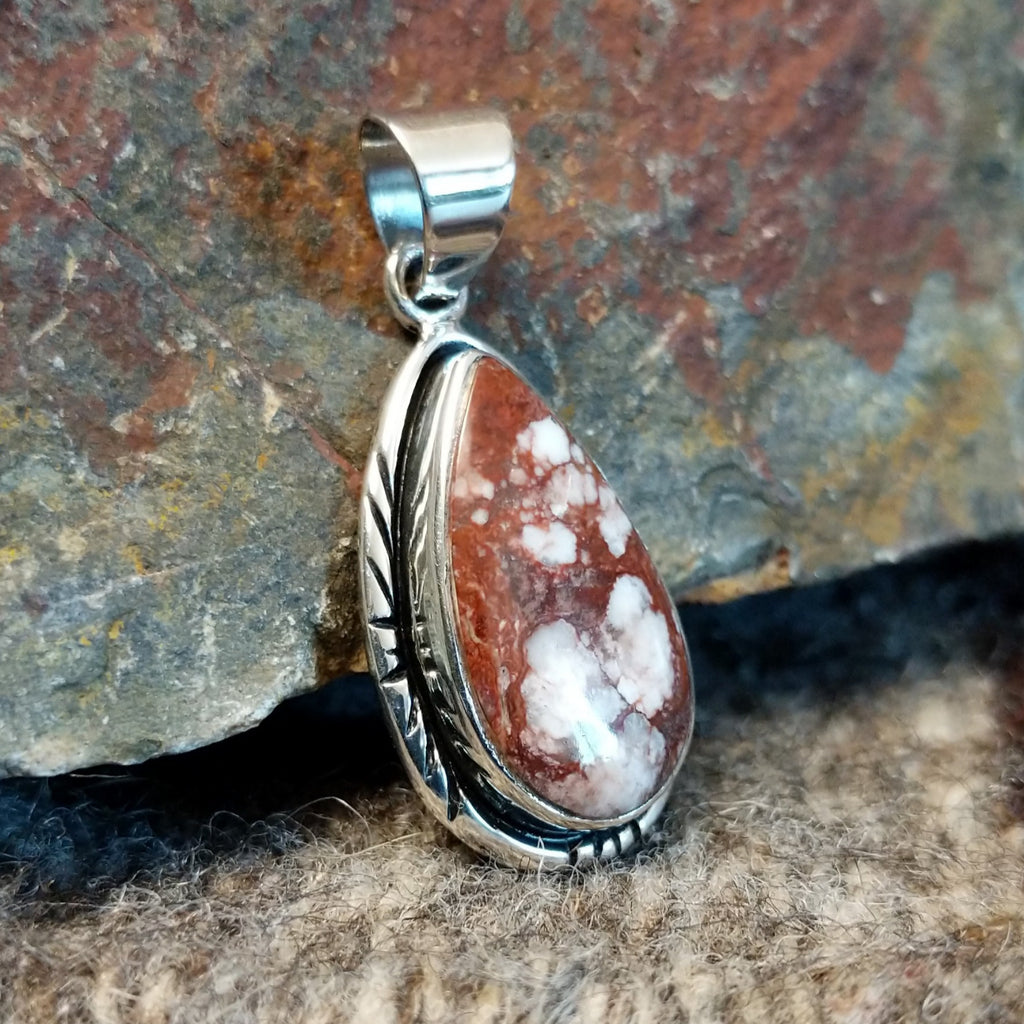 Wild horse stone set in a teardrop pendant with incised edges.