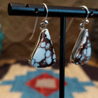 Sterling silver earrings featuring wild horse stones set in a triangular bezel.