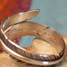 Close up of the artist's stamped signature