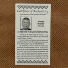 Close up of the Certificate of Authenticity and Artist information. 