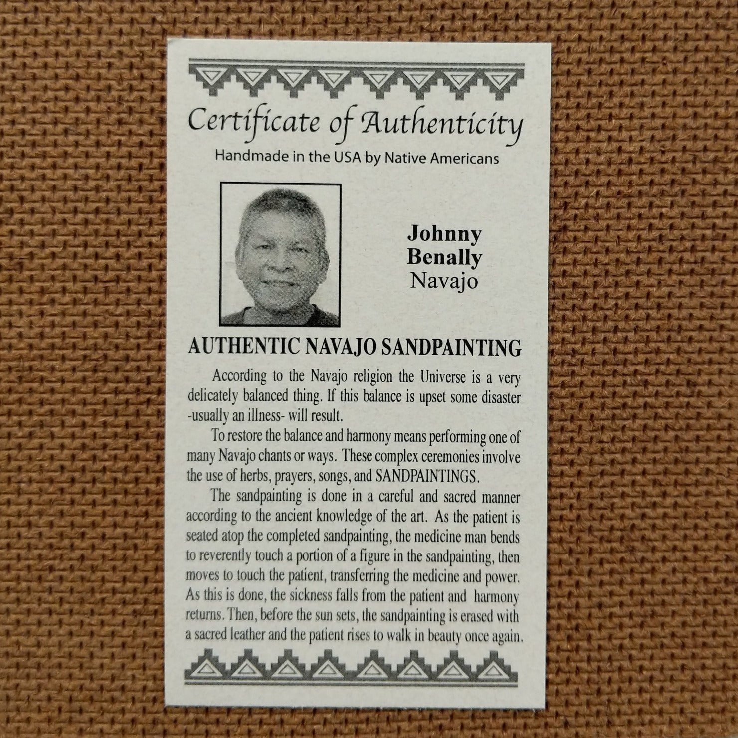 Close up of the Certificate of Authenticity and Artist information. 