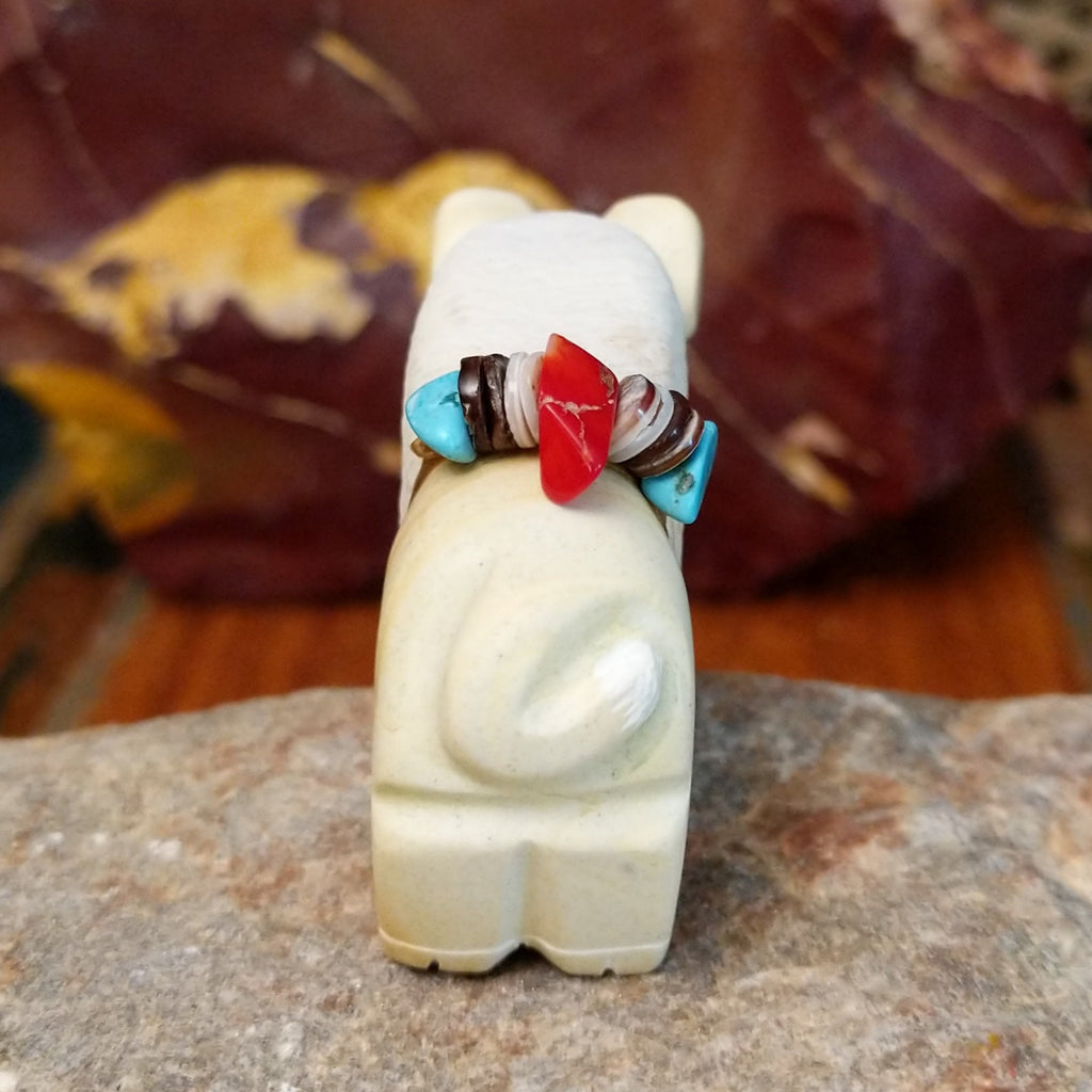 Utah sandstone carved into a bison with turquoise, coral, and pen shell beaded on it's back.