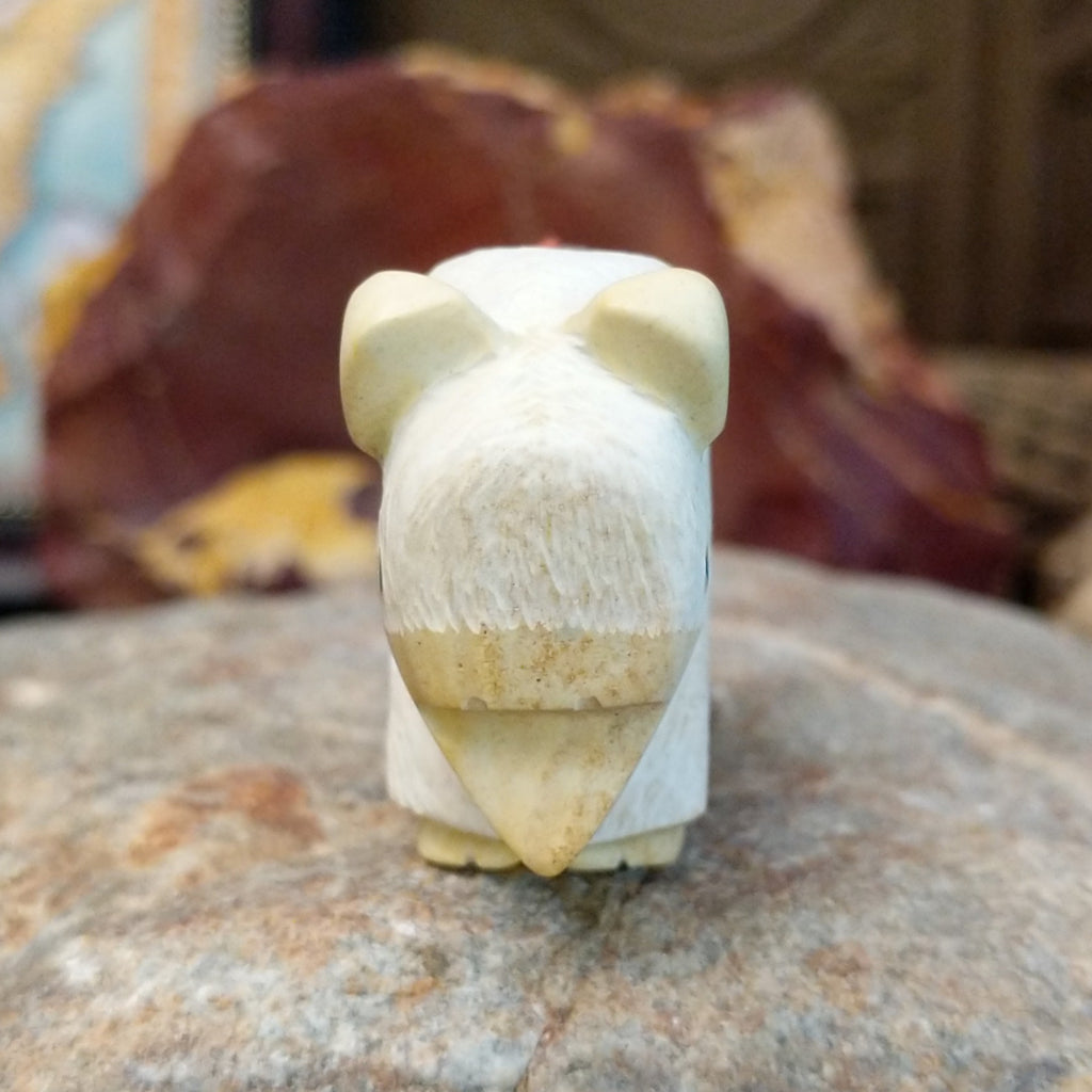 Utah sandstone carved into a bison with turquoise, coral, and pen shell beaded on it's back.