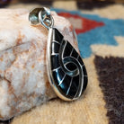 Sterling silver pendant with black onyx inlaid in the spiral of the teardrop setting.