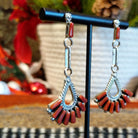Coral set in bezels that form a chandelier and are set on dangle posts.