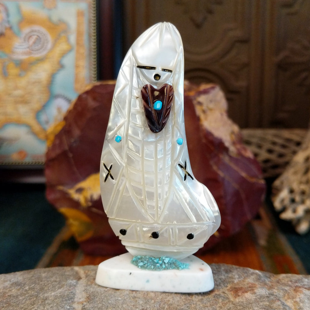 Zuni corn maiden fetish made from mother of pearl with turquoise accents along the body.