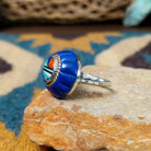 Handcrafted sterling silver Zuni dome ring by Lee & Mary Weebothee, featuring a colorful Sunface-inspired multistone inlay surrounded by lapis; side view.