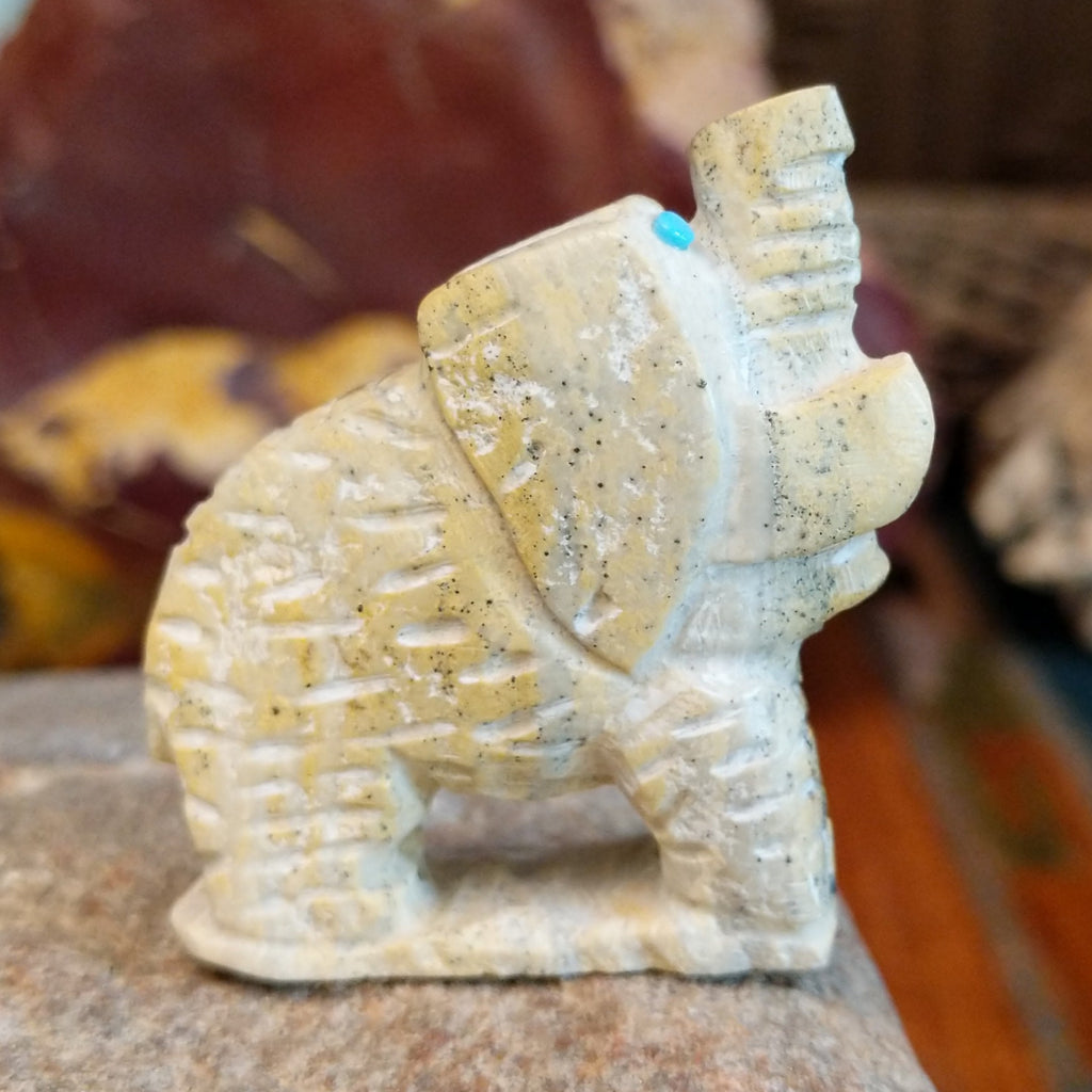 Serpentine carved into an elephant fetish with intricate carved details along its' body.