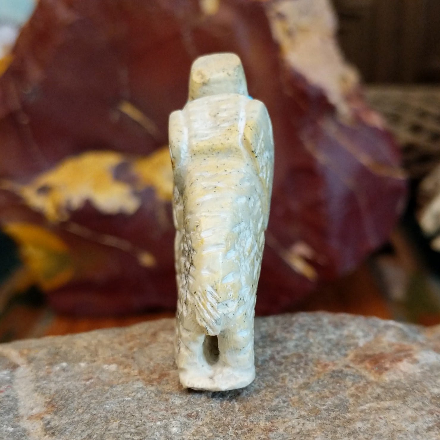 Serpentine carved into an elephant fetish with intricate carved details along its' body.