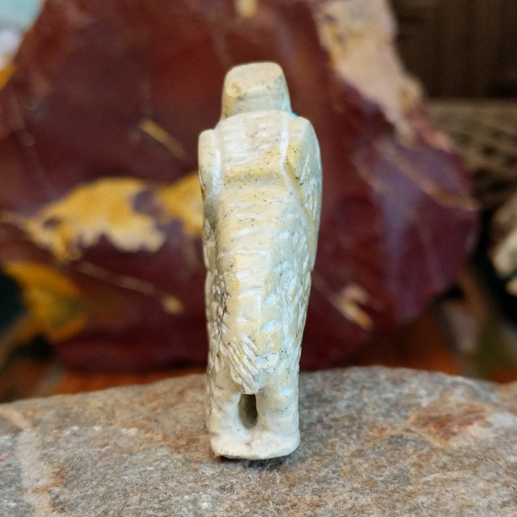 Serpentine carved into an elephant fetish with intricate carved details along its' body.