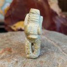 Serpentine carved into an elephant fetish with intricate carved details along its' body.