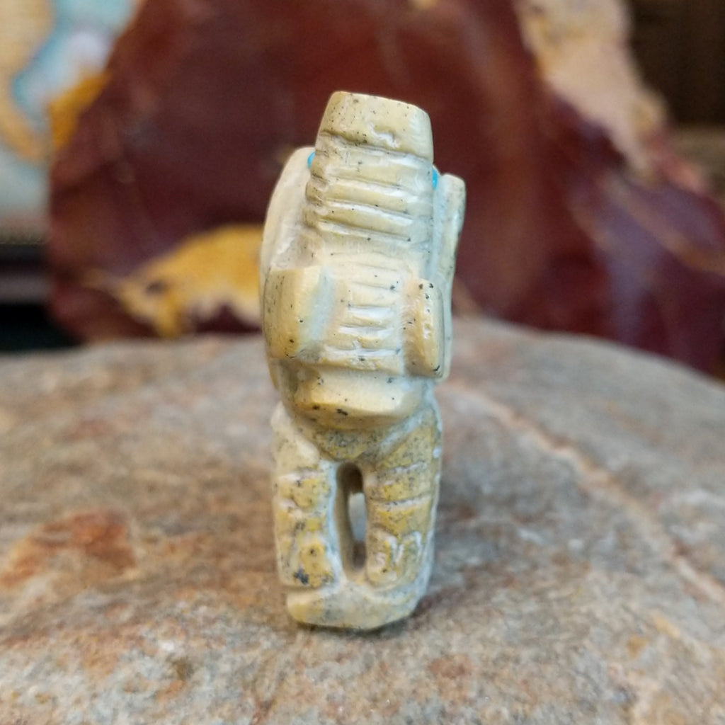 Serpentine carved into an elephant fetish with intricate carved details along its' body.