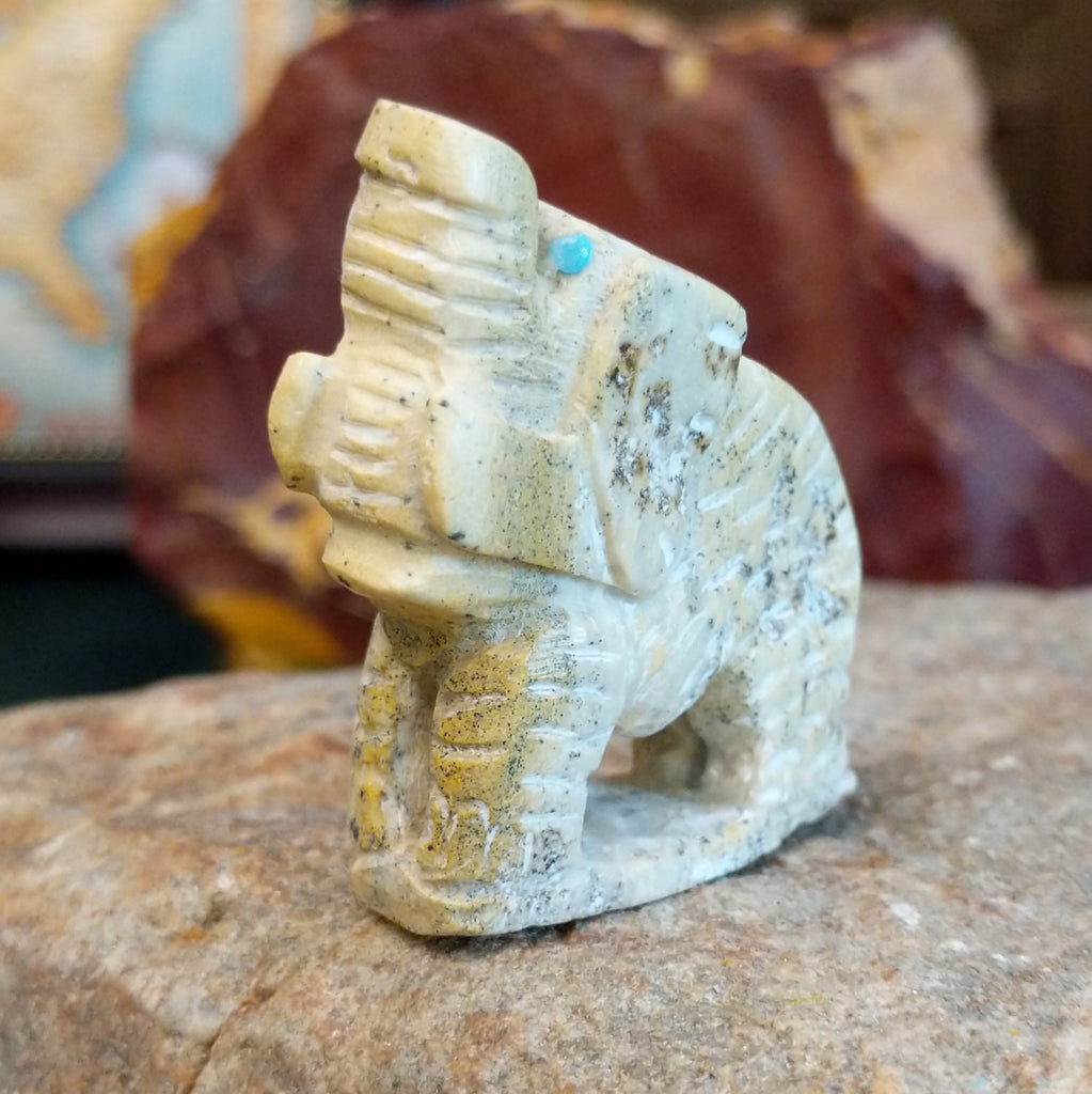 Serpentine carved into an elephant fetish with intricate carved details along its' body.