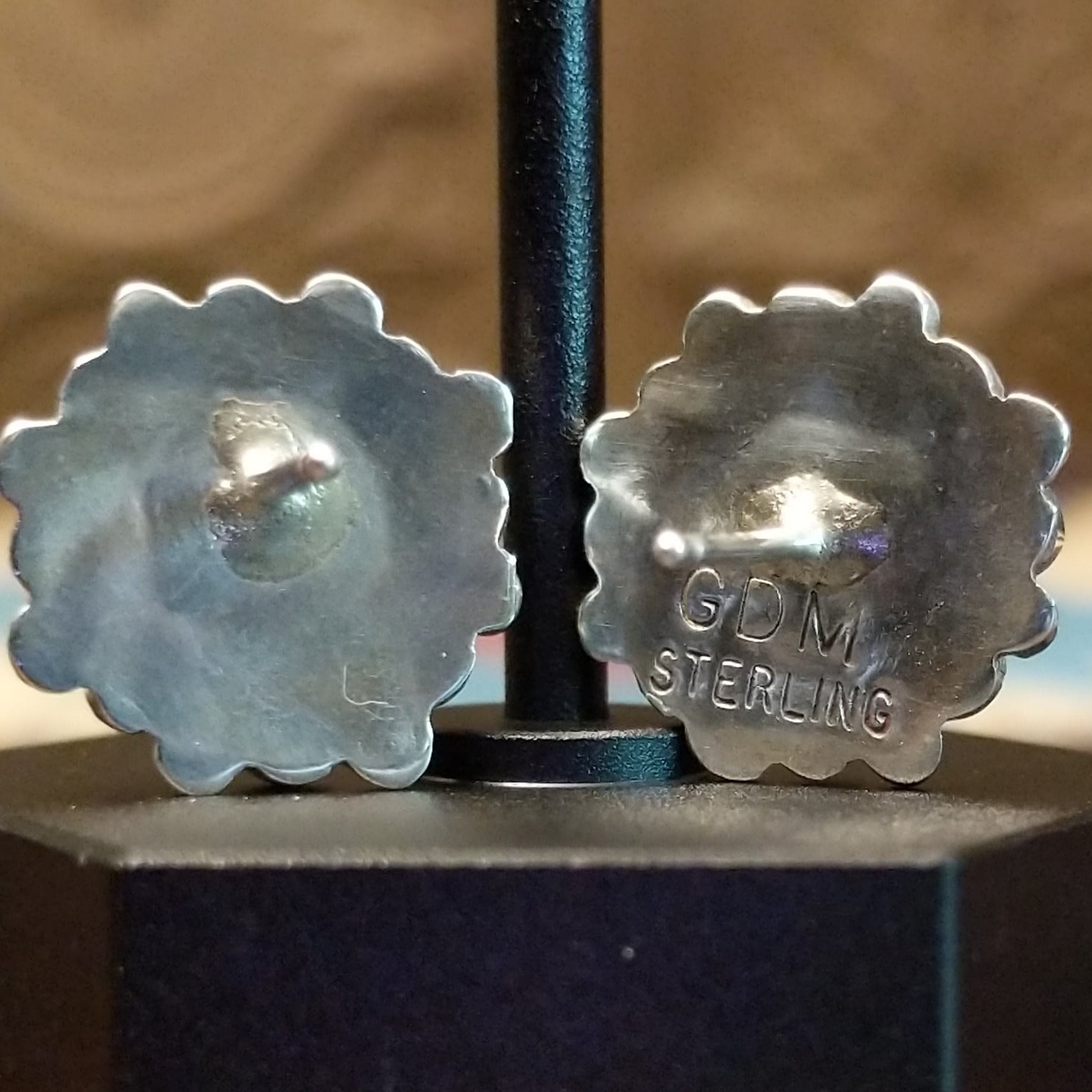 Close-up of the artisan's stamped signature.