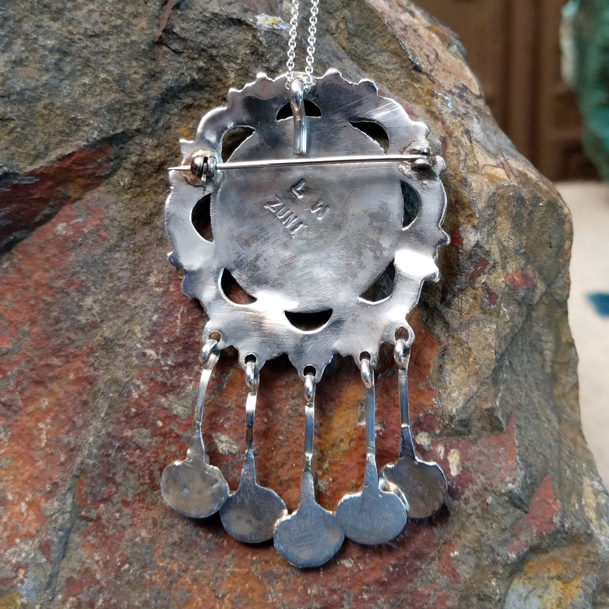 Zuni turquoise dangle pendant and pin by Lorraine Waatsa featuring a floral turquoise cluster, polished silver loops, twisted-wire detailing, and five turquoise-accented dangles; artisan and tribe stamp.