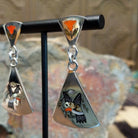 Handcrafted sterling silver Zuni hummingbird inlay earrings by Sanford Edaakie, featuring a two-piece dangle design with colorful flowers and hummingbirds; side view.