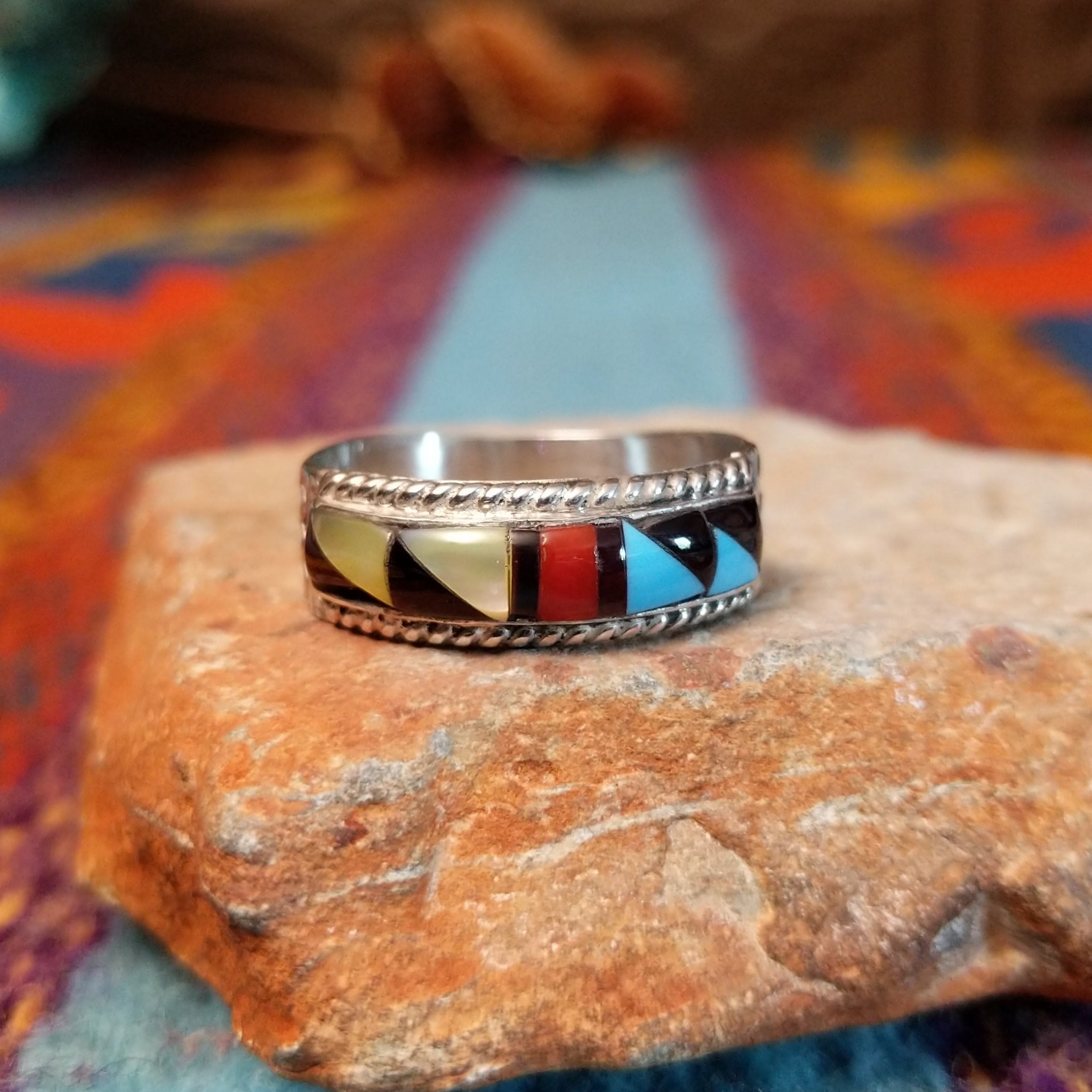 Zuni Inlay Ring by R. Sheyka with multistone geometric inlay and twisted silver borders.
