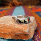 Zuni Inlay Ring by R. Sheyka with multistone geometric inlay and twisted silver borders.