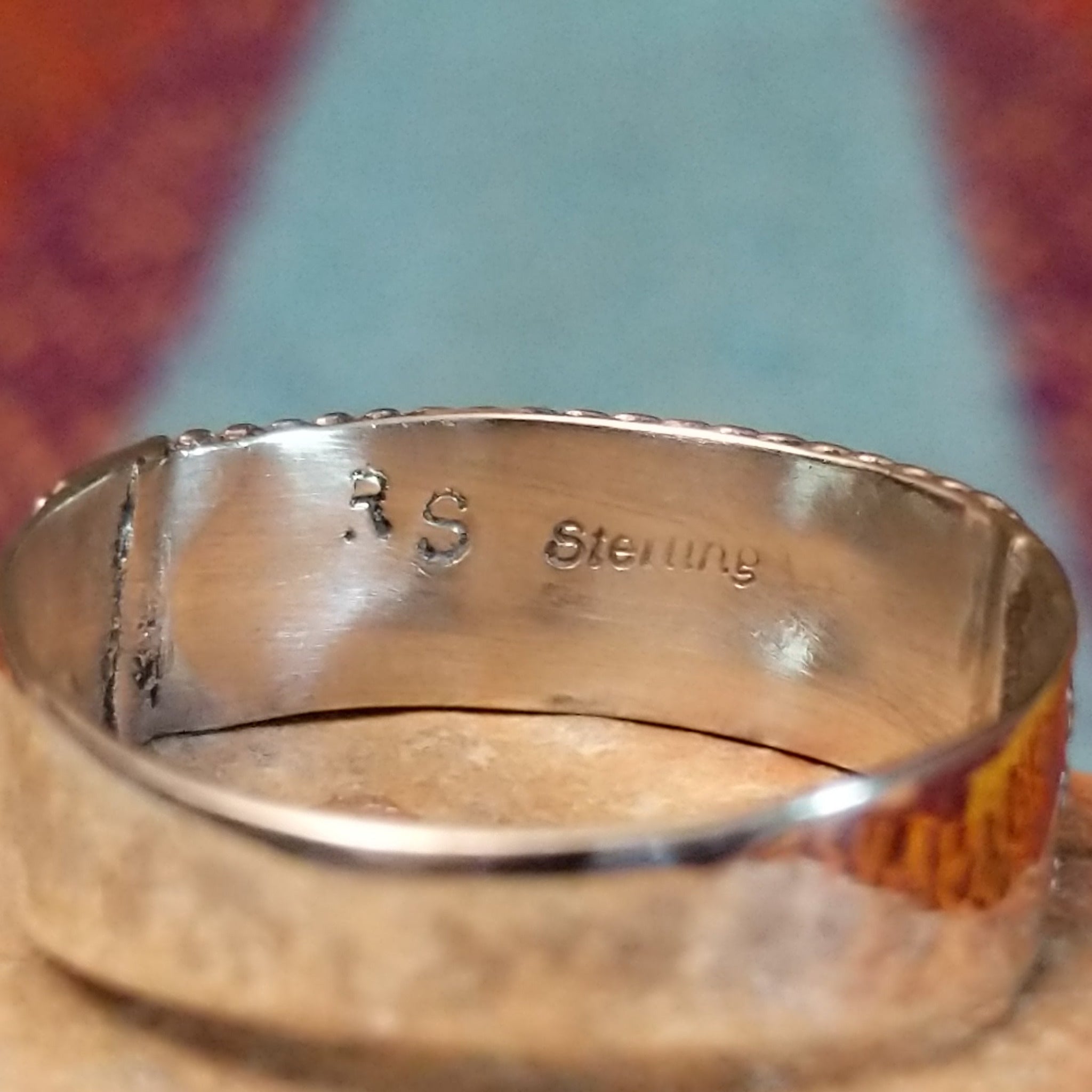 Close up of the artist's stamped signature
