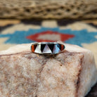 Zuni inlay ring by Tammie Qualo, featuring precisely fitted natural stones set in a handcrafted sterling silver band with traditional Zuni craftsmanship.