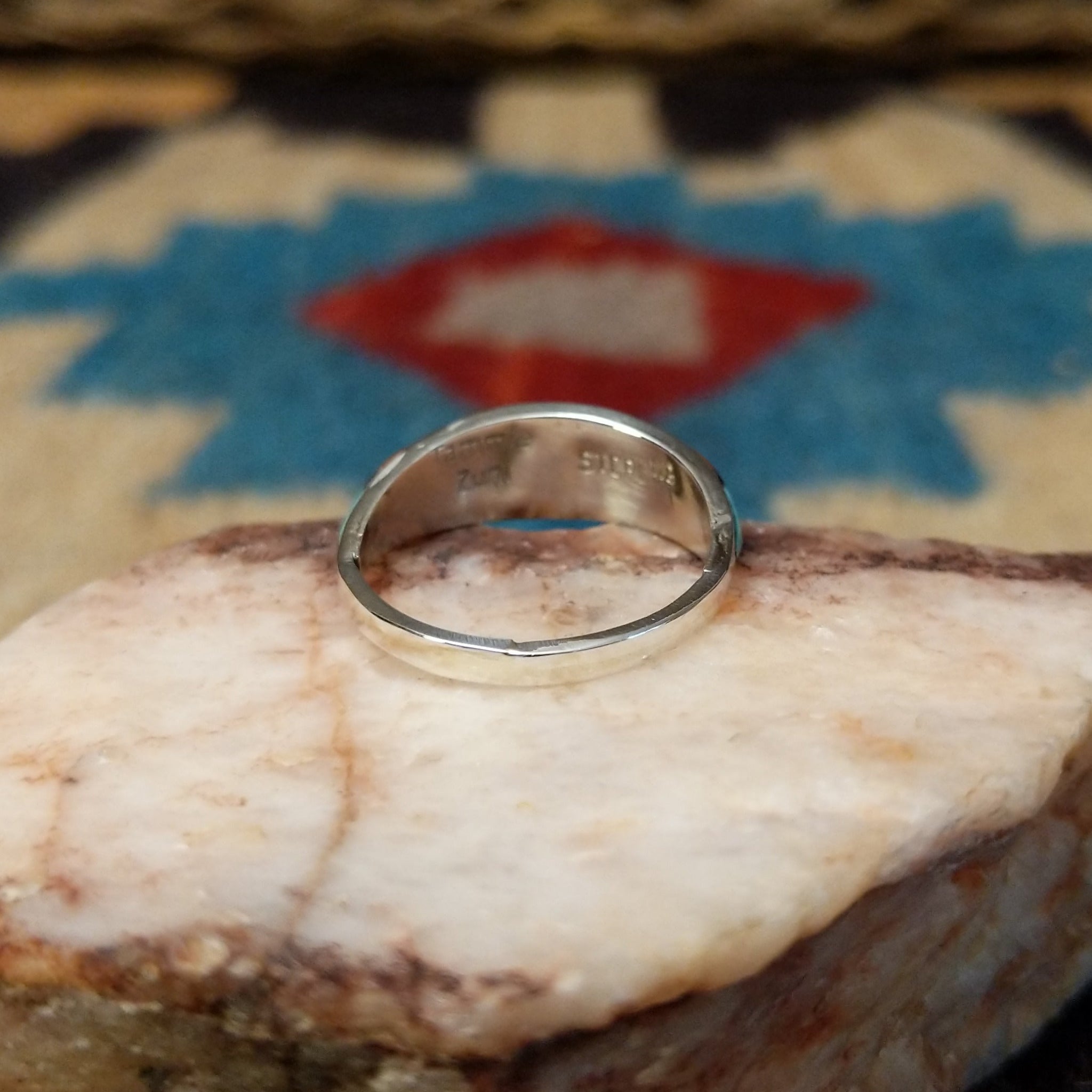 Zuni inlay ring by Tammie Qualo, featuring precisely fitted natural stones set in a handcrafted sterling silver band with traditional Zuni craftsmanship.  Underside view.