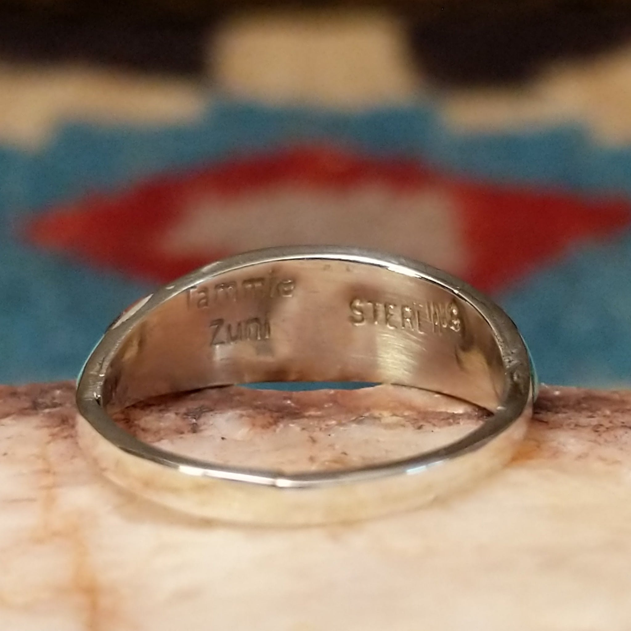 Zuni inlay ring by Tammie Qualo, featuring precisely fitted natural stones set in a handcrafted sterling silver band with traditional Zuni craftsmanship.  Artisan and Sterling Silver stamp.