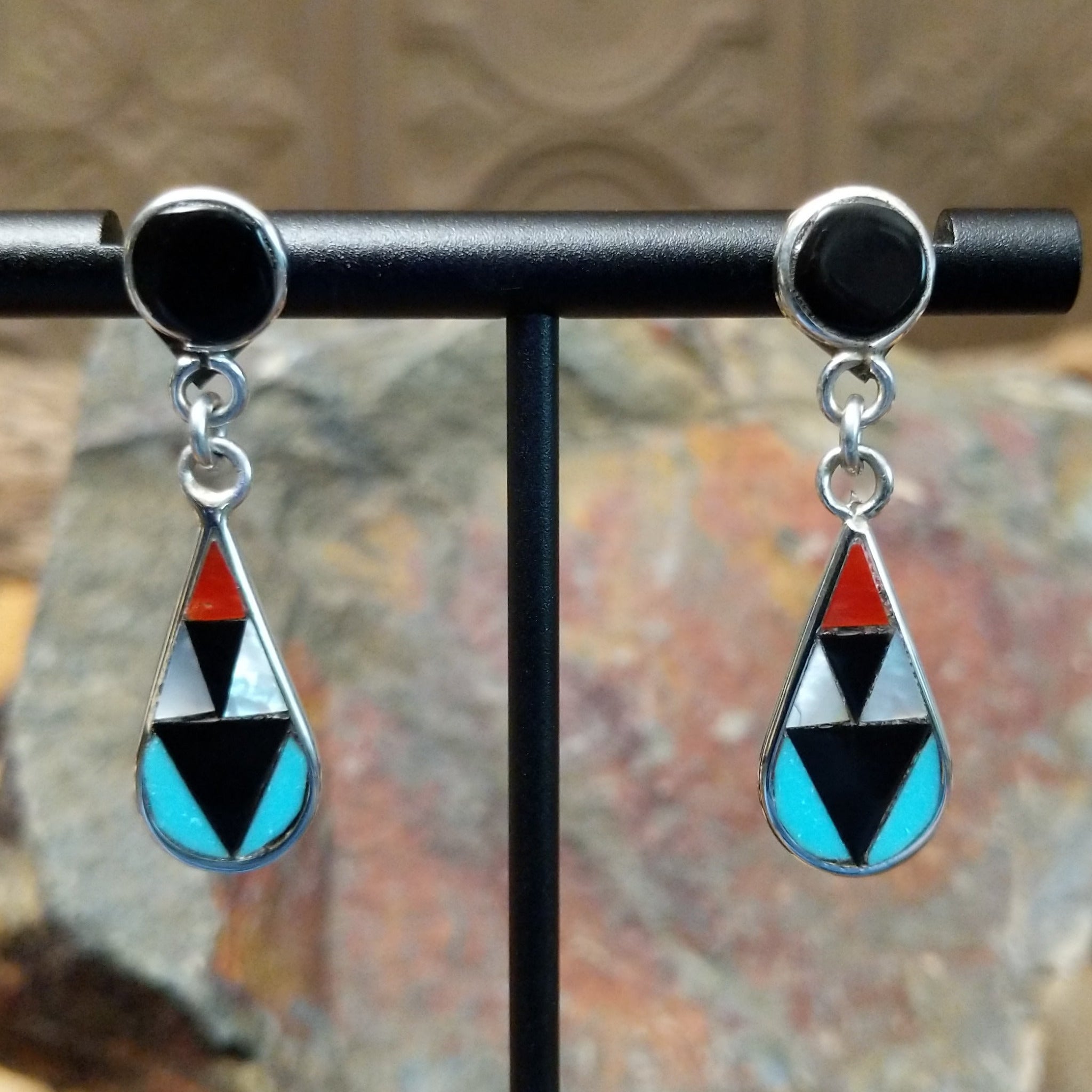 Handcrafted sterling silver Zuni inlay teardrop earrings by Florencia Lucio, featuring colorful multistone inlay in a classic teardrop design.