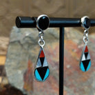 Handcrafted sterling silver Zuni inlay teardrop earrings by Florencia Lucio, featuring colorful multistone inlay in a classic teardrop design; side view.