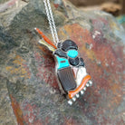 Handcrafted sterling silver Zuni Maiden pin and pendant by Andrea Shirley Lonjose, featuring intricate multistone inlay in a traditional Maiden design; side view.