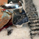 Close up of the artist's etched signature