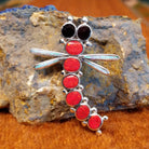 Sterling silver and red manmade opal, white manmade opal, and black onyx along the body of the dragonfly pendant.