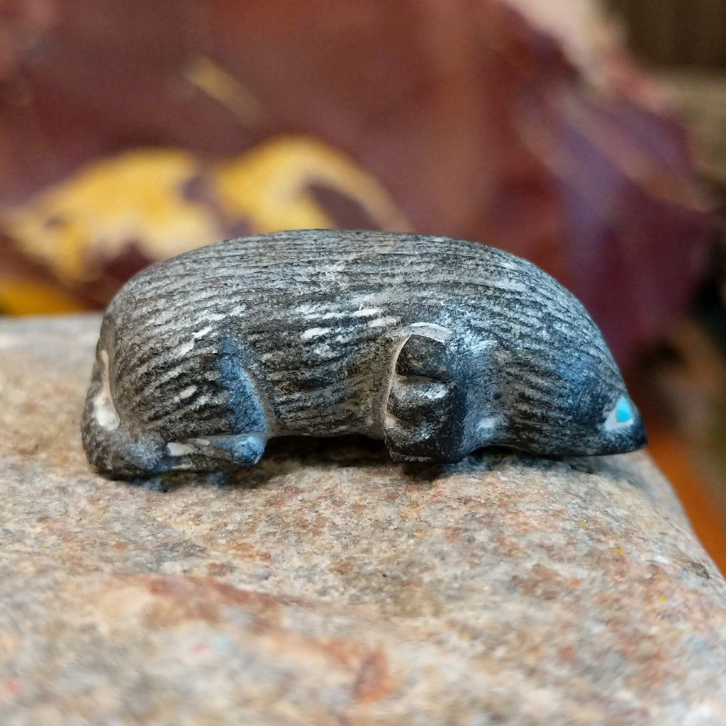 Black marble carved in the shape of a mole.