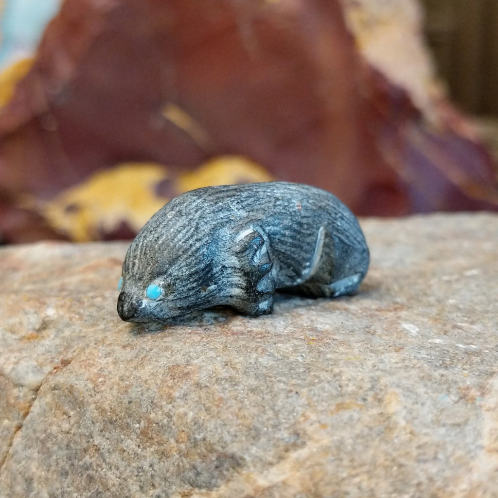 Black marble carved in the shape of a mole.