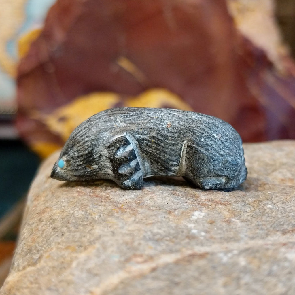 Black marble carved in the shape of a mole.