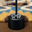 Handcrafted Zuni sterling silver flower earrings by Aaron Lasiloo featuring iridescent mother of pearl inlay in a delicate floral design with polished silver detailing.